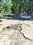 Дожди размыли огромную яму в асфальте на улице Белорусской в Чите